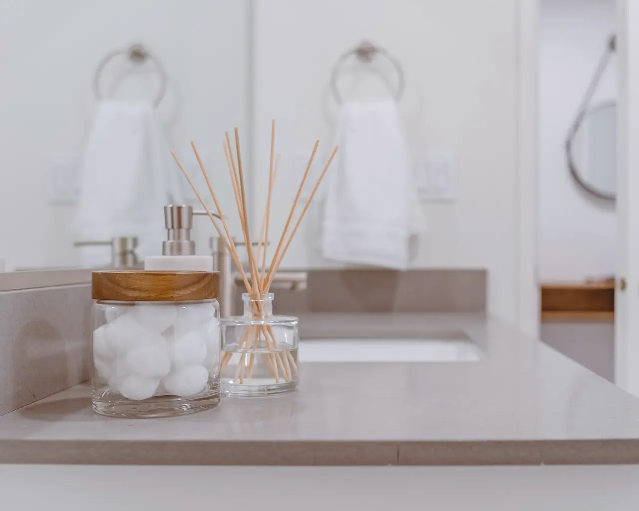 A bathroom vanity with hand towels and a tidy benchtop