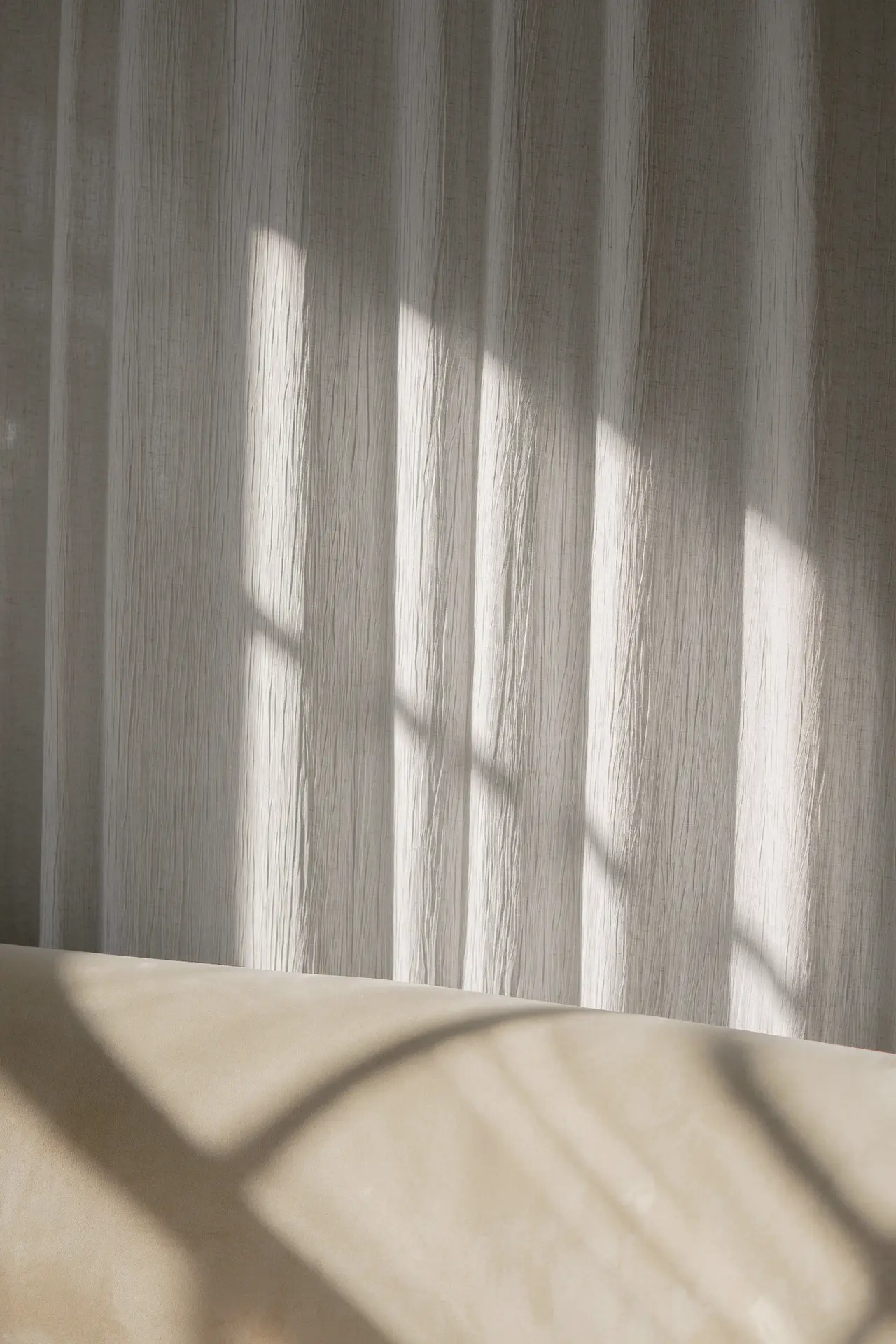 Sheer curtains with soft light and shadow