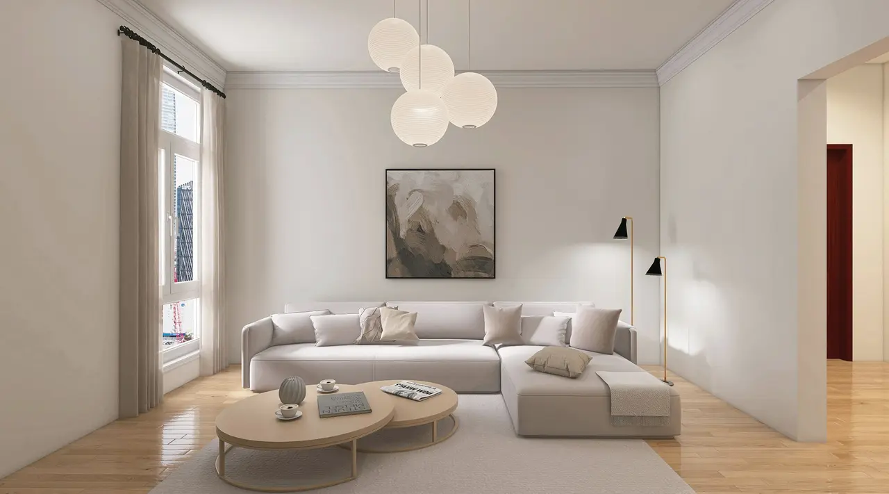 A neutral living room with a low sofa and round coffee table